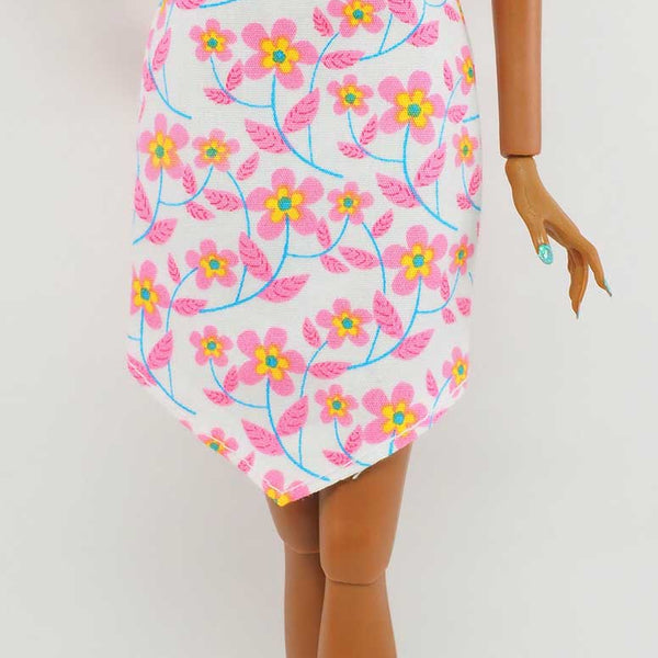 barbie fashionista white dress red flowers Fashion Avenue Pretty Floral Party with Purple Shoes Casual dresses feature trendy silhouettes with cool colors and fun prints Barbie Fashion Fever Modern Trends