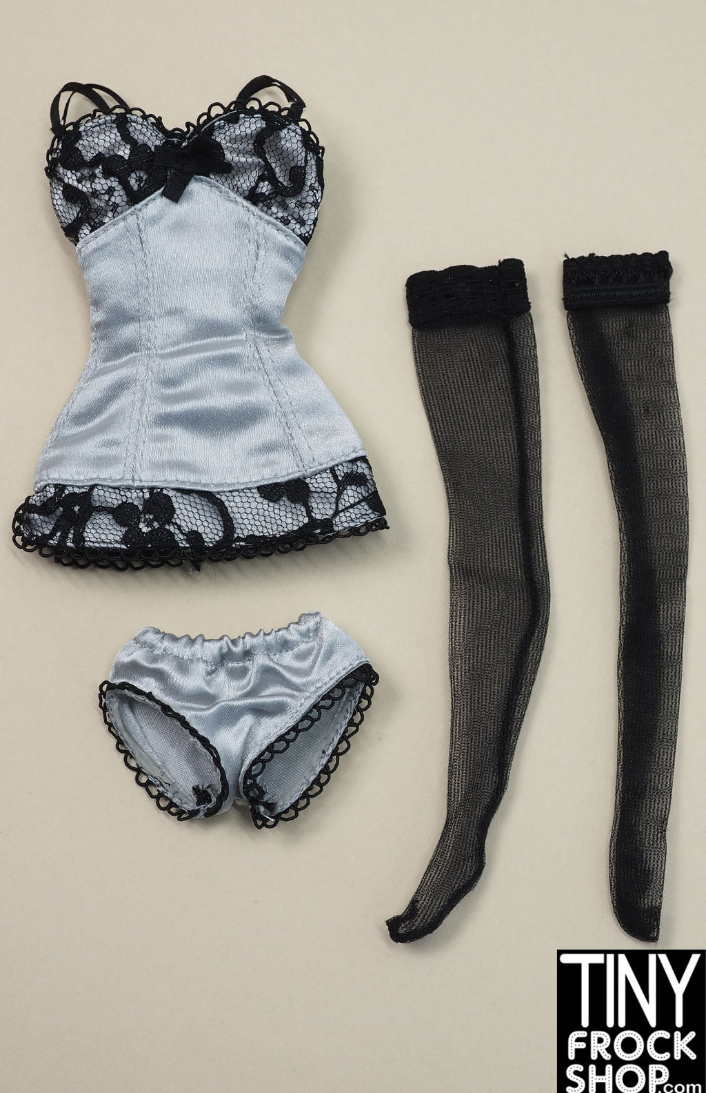 https://tinyfrockshop.com/cdn/shop/files/Barbie--2003-Fashion-Model-LIngerie-6-grey-and-black-lace-slip-and-panties4_1024x.jpg?v=1710349442